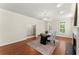 Comfortable office with neutral walls, hardwood floors, modern light fixture and a large desk at 5455 Malone Ct, Powder Springs, GA 30127