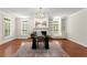 Bright office with neutral walls, hardwood floors, built-in shelving and a large desk at 5455 Malone Ct, Powder Springs, GA 30127