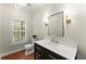 Powder room featuring a vanity, toilet, shutters and contemporary lighting at 5455 Malone Ct, Powder Springs, GA 30127