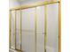 Shower features a gold frame and textured sliding glass doors at 5455 Malone Ct, Powder Springs, GA 30127