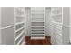 Custom walk-in closet boasts ample storage with shelving, drawers, and modern hardware at 5455 Malone Ct, Powder Springs, GA 30127