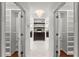 Walk-in closet with and compartments with custom shelving at 5455 Malone Ct, Powder Springs, GA 30127