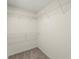 This walk-in closet has neutral walls, plush carpet, and wire shelving at 5455 Malone Ct, Powder Springs, GA 30127