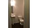 Bathroom featuring a pedestal sink and a standard toilet at 5671 Radford Loop, Fairburn, GA 30213