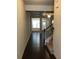 Spacious foyer with hardwood floors, staircase, and view into the living room at 5671 Radford Loop, Fairburn, GA 30213
