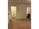 Hallway featuring carpet, doorway, and view of half bathroom at 5671 Radford Loop, Fairburn, GA 30213