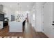 Bright kitchen boasts stainless appliances, stylish island with seating, and sleek herringbone backsplash at 989 Bibbs Circle # 25, Atlanta, GA 30318
