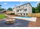 Inviting backyard with a cozy fire pit, swimming pool, spacious deck, and privacy fence at 2015 Clipper Straits, Snellville, GA 30078