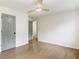 Bedroom featuring hardwood floors, ceiling fan, and gray doors at 2015 Clipper Straits, Snellville, GA 30078