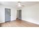 Bedroom featuring hardwood floors, ceiling fan, and gray doors at 2015 Clipper Straits, Snellville, GA 30078