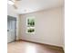 Bright bedroom with hardwood floors, natural light, and a gray door at 2015 Clipper Straits, Snellville, GA 30078