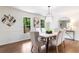 Dining room with hardwood floors, decorative lighting, and views of the backyard at 2015 Clipper Straits, Snellville, GA 30078