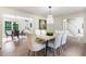 Open dining area with hardwood floors and modern lighting at 2015 Clipper Straits, Snellville, GA 30078