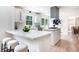 Kitchen featuring a quartz countertop island with seating and stainless steel appliances at 2015 Clipper Straits, Snellville, GA 30078