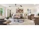 Bright and inviting living room featuring stylish furnishings, neutral decor, and ample natural light at 2015 Clipper Straits, Snellville, GA 30078