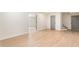 Spacious living room showing the light hardwood floors and fresh coat of paint at 2015 Clipper Straits, Snellville, GA 30078