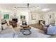 Beautiful living room featuring hardwood floors, fireplace, stylish furnishings, and bright, modern decor at 2015 Clipper Straits, Snellville, GA 30078