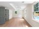 Bright living room with hardwood floors, large windows, and direct access to the outdoor pool area at 2015 Clipper Straits, Snellville, GA 30078