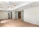 Spacious living room with hardwood floors, a ceiling fan, recessed lighting and access to a bathroom at 2015 Clipper Straits, Snellville, GA 30078