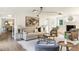 Elegant living room with hardwood floors, a fireplace, comfortable seating, and modern furnishings at 2015 Clipper Straits, Snellville, GA 30078
