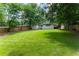 Large, well-maintained backyard with a privacy fence surrounding a spacious lawn at 2617 Warwick Ne Cir, Atlanta, GA 30345