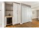 Dining space featuring built-in bar and cabinets with wine fridge at 2617 Warwick Ne Cir, Atlanta, GA 30345