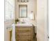 Bathroom features neutral colors and a single vanity with a wood grain cabinet at 2617 Warwick Ne Cir, Atlanta, GA 30345