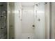 Modern bathroom features glass shower with sleek white tiling and contrasting grout at 2617 Warwick Ne Cir, Atlanta, GA 30345