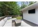 Relaxing outdoor deck with comfortable seating and a mounted TV, perfect for entertaining at 2617 Warwick Ne Cir, Atlanta, GA 30345