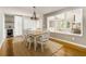 Open dining room with modern lighting and hardwood floors at 2617 Warwick Ne Cir, Atlanta, GA 30345