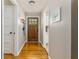 Bright entryway with hardwood floors, coat rack, and view into the kitchen at 2617 Warwick Ne Cir, Atlanta, GA 30345