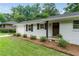 Close-up of the home's front exterior with new landscaping and an inviting front door at 2617 Warwick Ne Cir, Atlanta, GA 30345