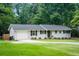 Charming single-story home with a well-manicured lawn and attached garage at 2617 Warwick Ne Cir, Atlanta, GA 30345