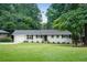 Charming single-story home with well-manicured lawn and mature trees at 2617 Warwick Ne Cir, Atlanta, GA 30345