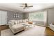 Comfortable living room with plush sectional sofa, stylish decor, and large windows at 2617 Warwick Ne Cir, Atlanta, GA 30345