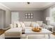 Inviting living room with a sectional couch, neutral tones, and plenty of natural light at 2617 Warwick Ne Cir, Atlanta, GA 30345
