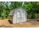 Exterior view of a well-maintained shed with double doors in the backyard at 2617 Warwick Ne Cir, Atlanta, GA 30345