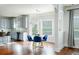Charming dining area with hardwood floors, a chandelier, and ample natural light at 3869 Maiden Fern Ln, Snellville, GA 30039