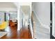 Inviting foyer featuring hardwood floors, staircase, and views into the dining room, creating an elegant entrance at 3869 Maiden Fern Ln, Snellville, GA 30039