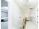Upstairs hallway with carpet, decorative light fixtures, and views to bedrooms at 3869 Maiden Fern Ln, Snellville, GA 30039
