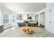 Open kitchen and breakfast area lead to the living room, perfect for entertaining at 3869 Maiden Fern Ln, Snellville, GA 30039