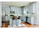 Kitchen with gray cabinets, stainless steel appliances, and a stylish backsplash at 3869 Maiden Fern Ln, Snellville, GA 30039