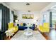 Bright living room featuring hardwood floors, stylish furniture, and elegant decor creating a welcoming atmosphere at 3869 Maiden Fern Ln, Snellville, GA 30039