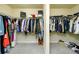 Spacious walk-in closet with ample hanging space and shelving for optimal organization at 3869 Maiden Fern Ln, Snellville, GA 30039