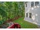 Spacious backyard with colorful flowers and lush trees, providing a serene outdoor space at 1575 Wynridge Pointe, Alpharetta, GA 30005