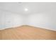 Finished basement featuring bright lighting, wood-look flooring, and convenient closet space at 1575 Wynridge Pointe, Alpharetta, GA 30005