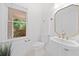 Cozy half bathroom with a pedestal sink and a window at 1575 Wynridge Pointe, Alpharetta, GA 30005