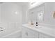 Bright bathroom featuring a tub shower combination and a modern white vanity at 1575 Wynridge Pointe, Alpharetta, GA 30005