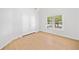 Bedroom featuring a light wood floor and a closet with double doors at 1575 Wynridge Pointe, Alpharetta, GA 30005