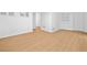 Open bedroom featuring hardwood floors, a closet, and a bright window at 1575 Wynridge Pointe, Alpharetta, GA 30005